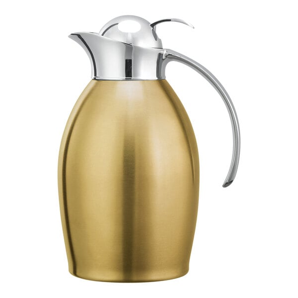 A gold and stainless steel Service Ideas Nicollet coffee carafe with a push button lid.