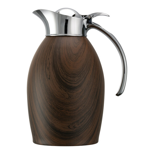 A brown and silver stainless steel Service Ideas Nicollet coffee carafe with a dark wood handle and flip top lid.