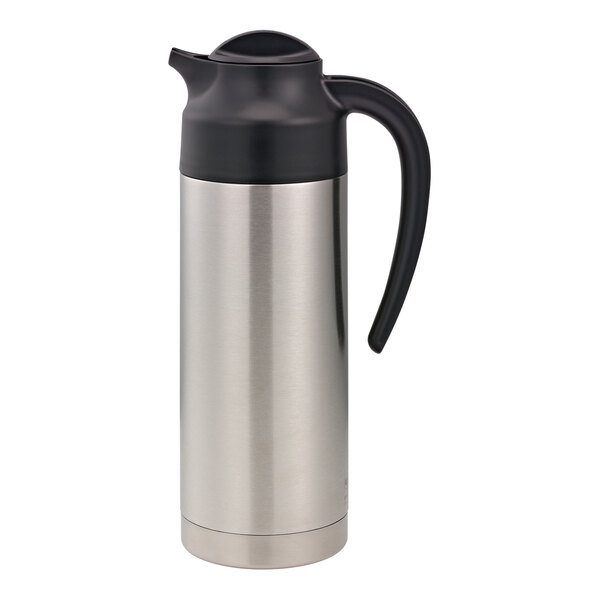 A stainless steel Service Ideas SteelVac creamer with a black lid.