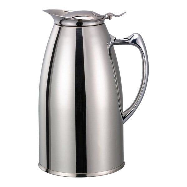 A silver stainless steel pitcher with a handle and lid.