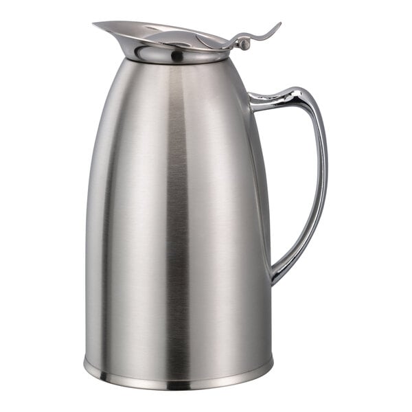 A stainless steel Service Ideas foam insulated coffee pitcher with a handle.