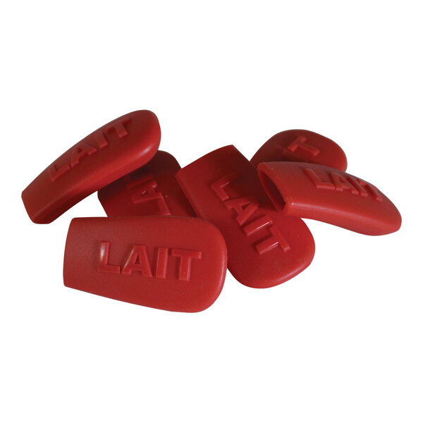 A pile of red silicone key caps with the word "Lait" on them.
