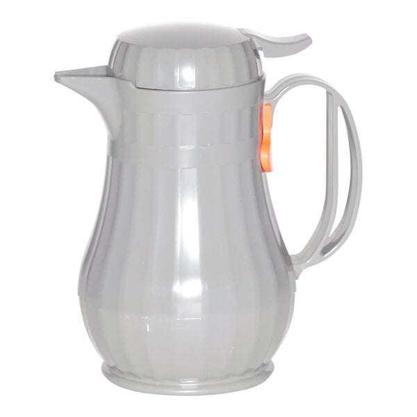 A slate gray plastic coffee carafe with a handle and orange lid.