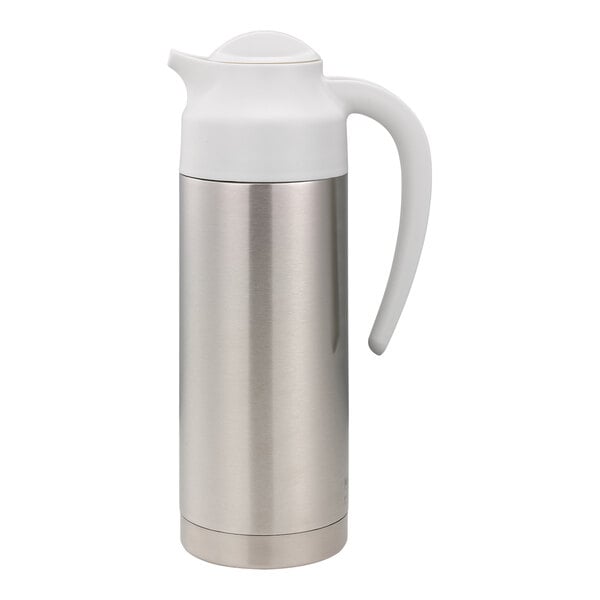 A stainless steel Service Ideas SteelVac creamer with a white lid.