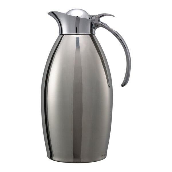 A stainless steel Service Ideas Nicollet coffee carafe with a handle.