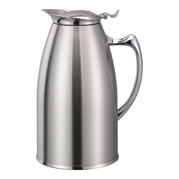 A stainless steel Service Ideas foam insulated coffee pitcher with a handle and lid.