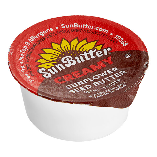 A SunButter portion cup with a white lid containing SunButter.