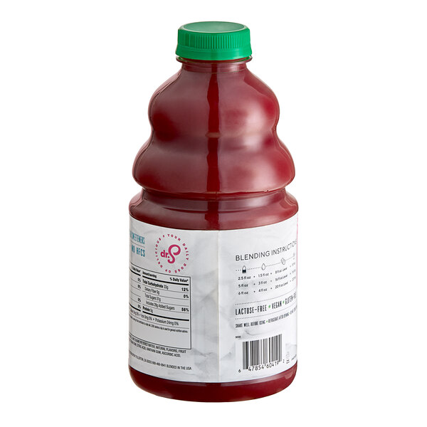 A bottle of Dr. Smoothie Classic Strawberry Banana fruit smoothie mix with red liquid inside.
