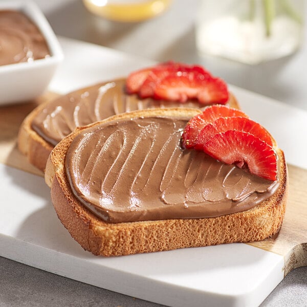 Two pieces of toast with SunButter chocolate spread on top.