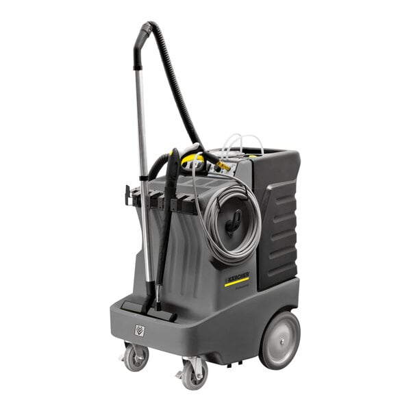 A Karcher multi-surface cleaning machine with a hose and handle on wheels.