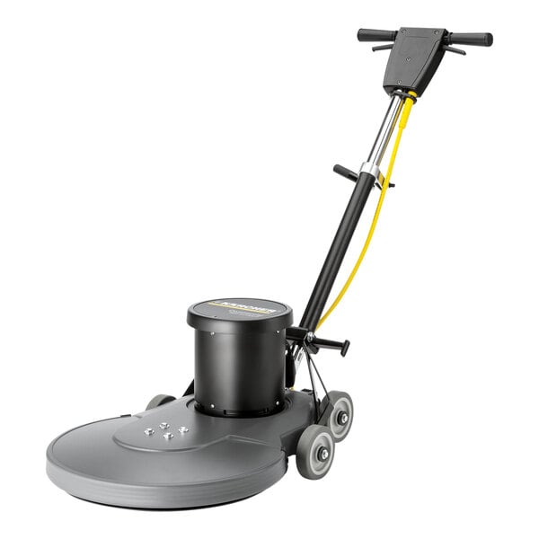 A Karcher floor burnishing machine with a yellow handle and black wheels.