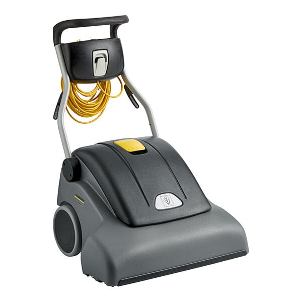 A grey and black Karcher wide area vacuum cleaner with a yellow cord.