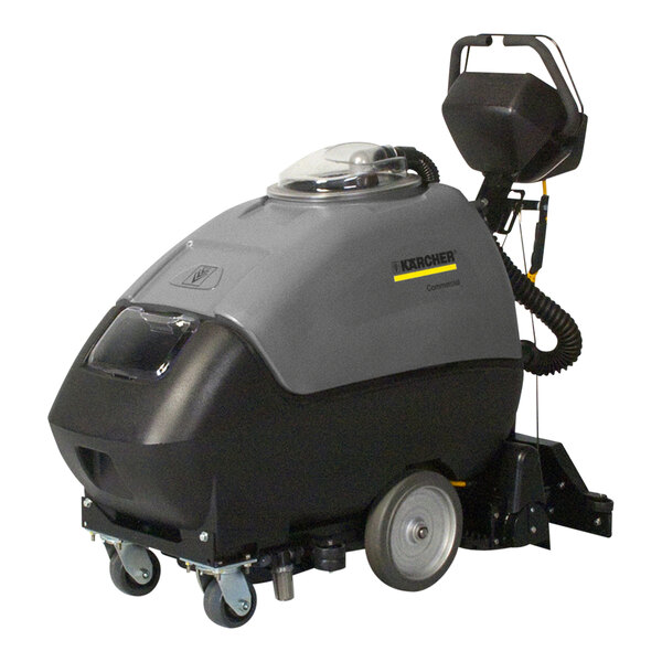 A Karcher self-contained walk behind carpet extractor with wheels and a handle.