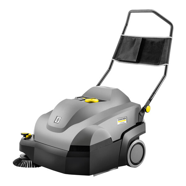 A Karcher carpet sweeper with wheels and a handle.