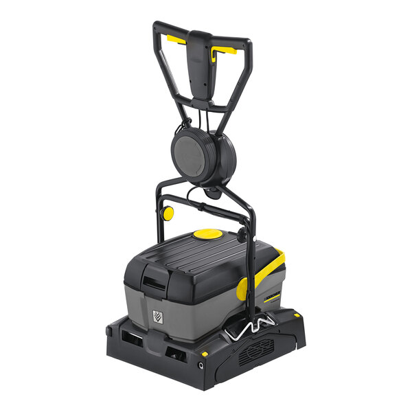 A black and grey Karcher walk-behind cylindrical floor scrubber with a handle.