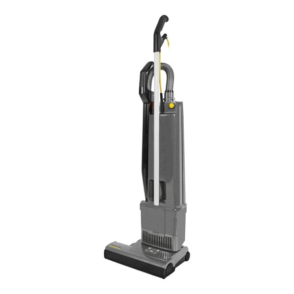 A Karcher Versamatic HEPA 14 bagged upright vacuum cleaner with a yellow handle.