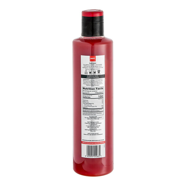 A close up of a SHOTT Pink Guava syrup bottle with a red label.