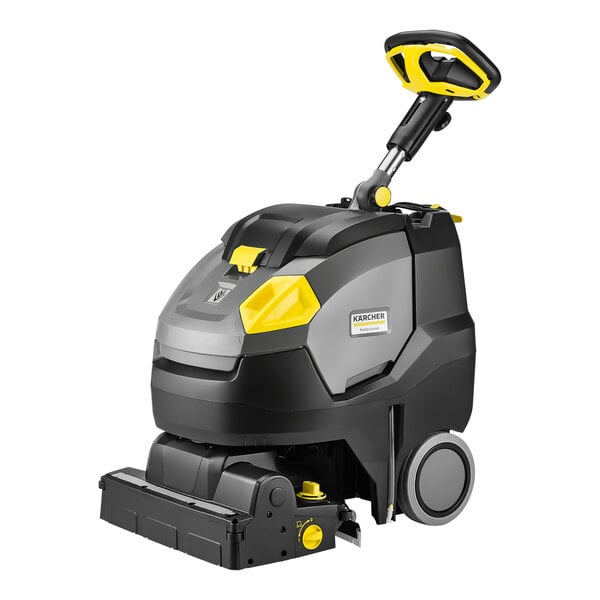 A Karcher walk-behind cylindrical floor scrubber with a handle.