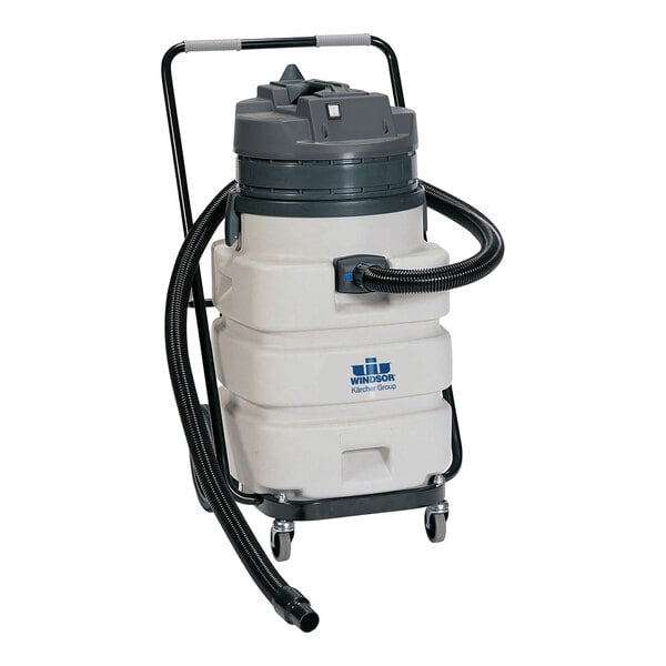 A white and black Karcher Titan wet/dry vacuum with a hose.