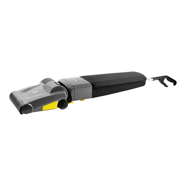 A black and grey Karcher Sensor cordless upright vacuum cleaner with a yellow handle.