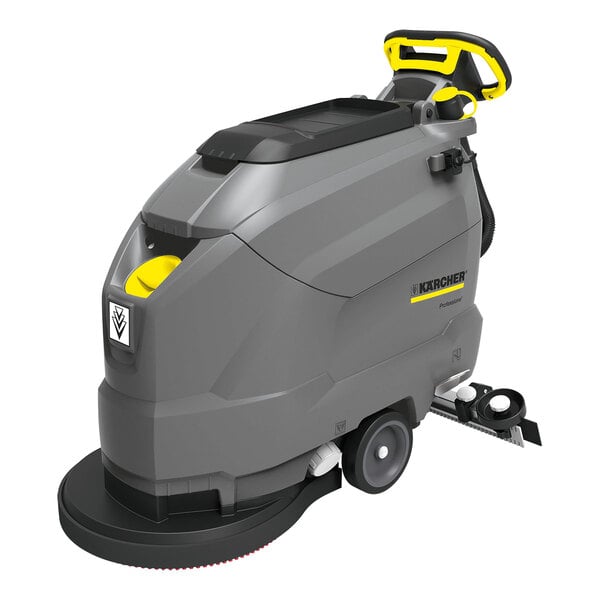 A Karcher walk-behind floor scrubber with wheels and a handle.