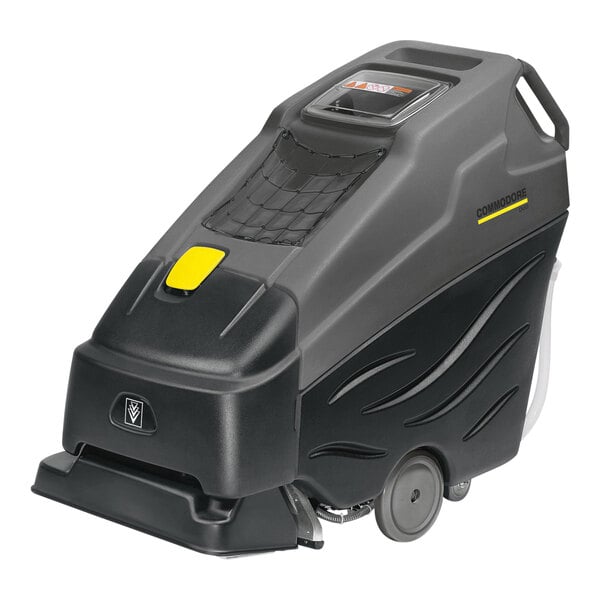 A black Karcher walk behind carpet extractor machine with wheels and a handle.