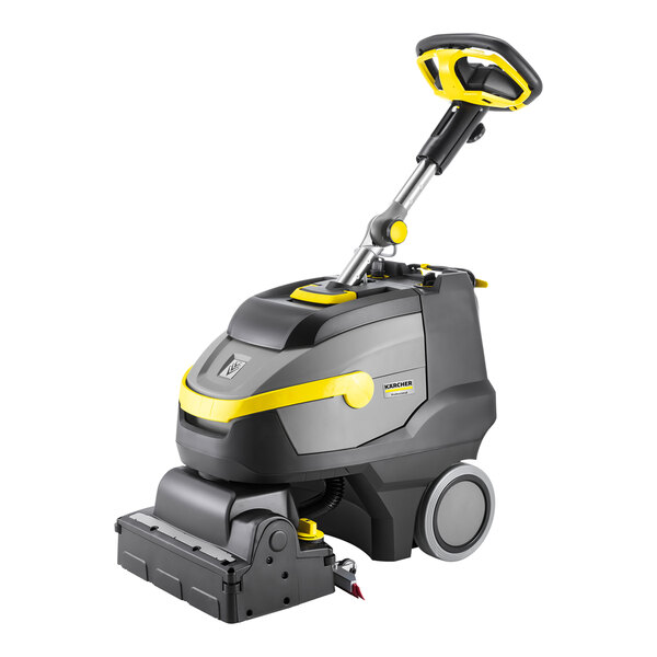 A Karcher walk-behind cylindrical floor scrubber with a handle.