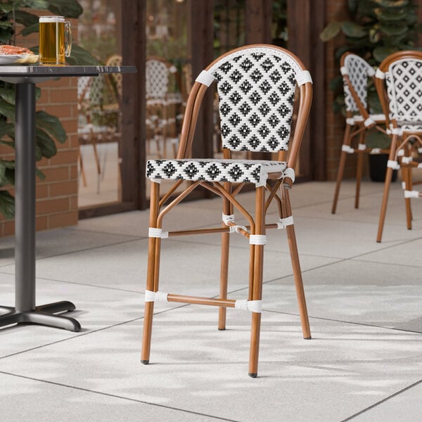 Lancaster Table & Seating Bistro Black and White Birdseye Weave Rattan Counter Height Outdoor Side Stool