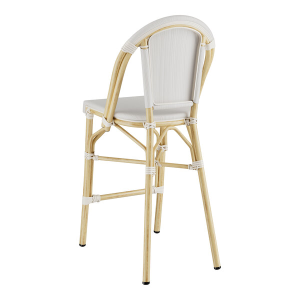 A gray Lancaster Table & Seating outdoor counter height bar stool with a white cushion.