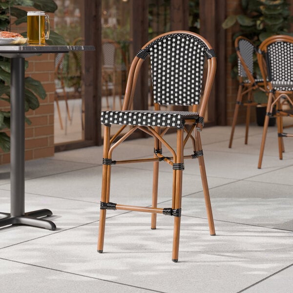 Lancaster Table & Seating Bistro Black and White Checkered Weave Rattan Counter Height Outdoor Side Stool