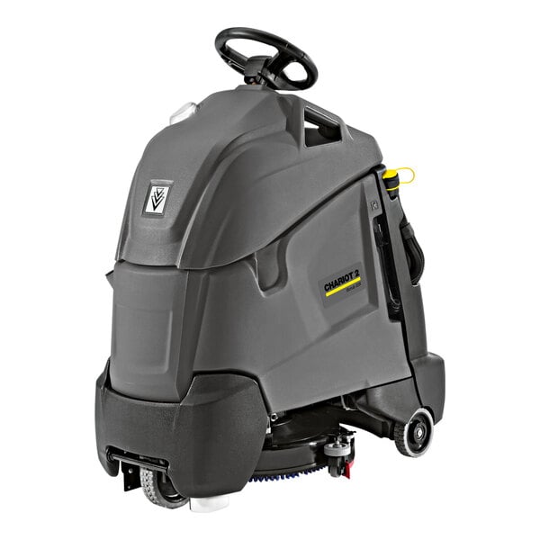 A Karcher commercial floor scrubber with wheels and a yellow handle.