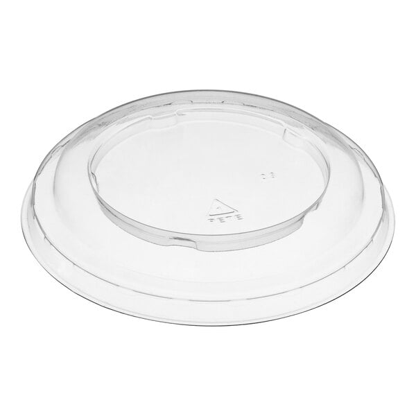 A clear plastic lid with a triangle on top.