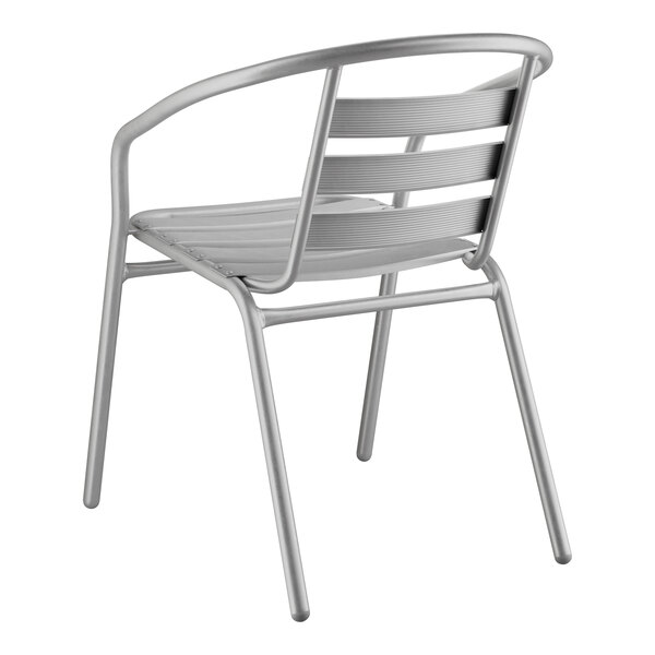 A silver powder-coated steel Lancaster Table & Seating outdoor arm chair.