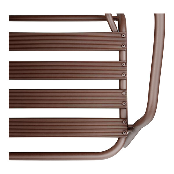 A close up of a bronze powder-coated steel arm chair.