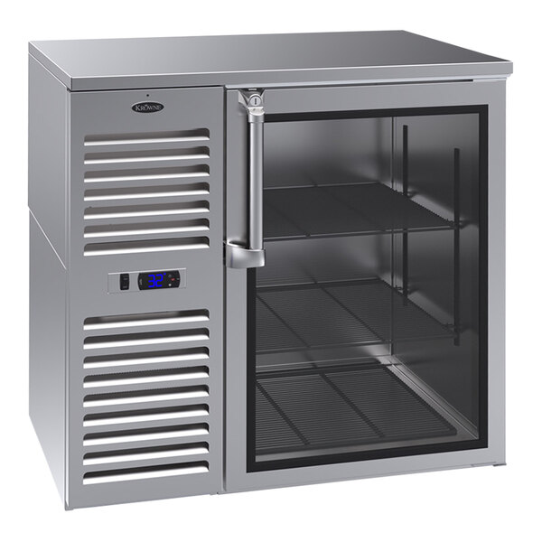 A Krowne stainless steel back bar refrigerator with glass doors.