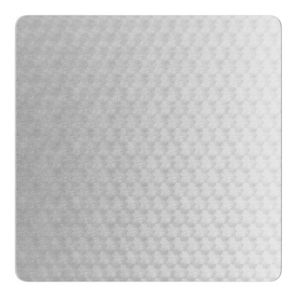 A white square table with a pattern on the surface.