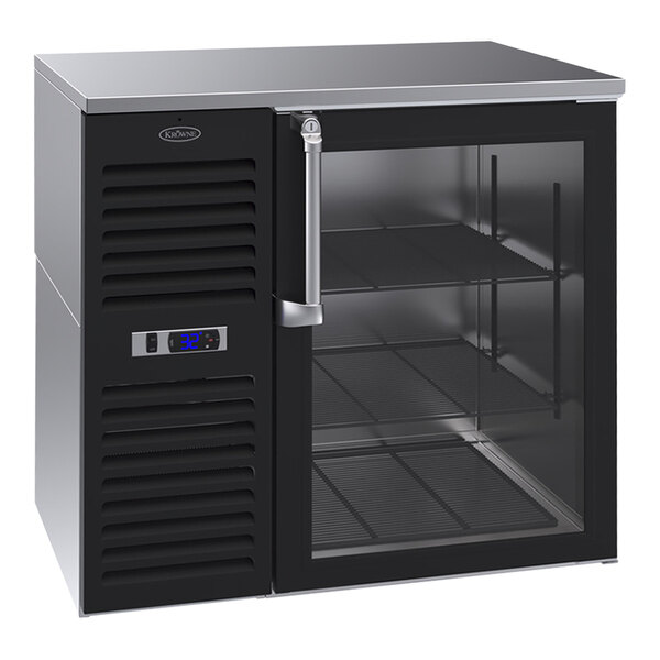 A black Krowne back bar refrigerator with glass doors and stainless steel top and left side.