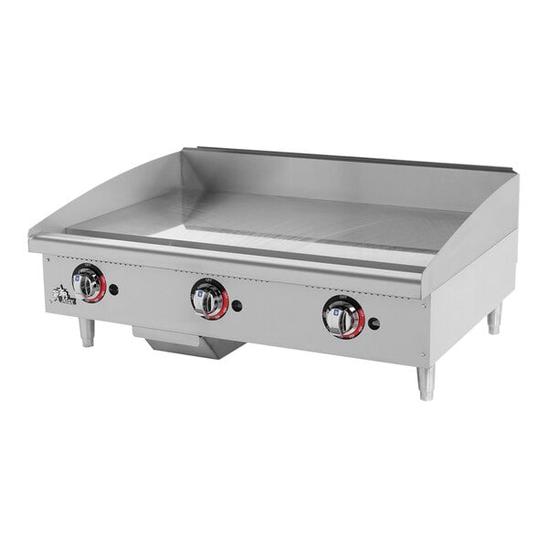 A stainless steel Star-Max gas countertop griddle with manual controls.