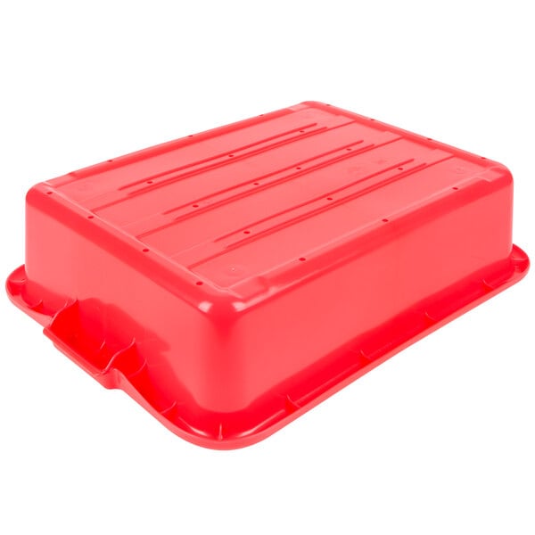 A red Vollrath Traex plastic drain box with a handle.