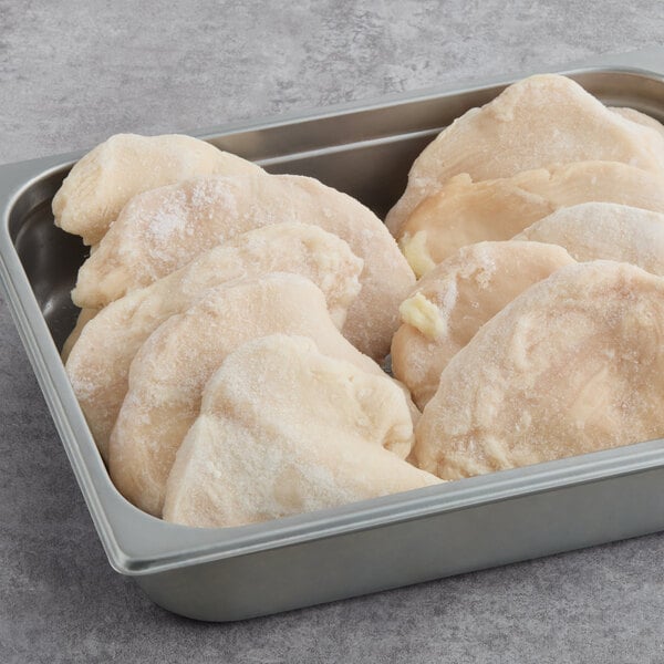 A tray of frozen Brakebush Farm Pantry boneless skinless Halal chicken fillets.
