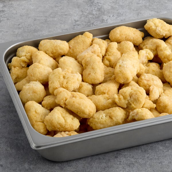 A tray of Brakebush Tappers beer battered boneless wings on a table.