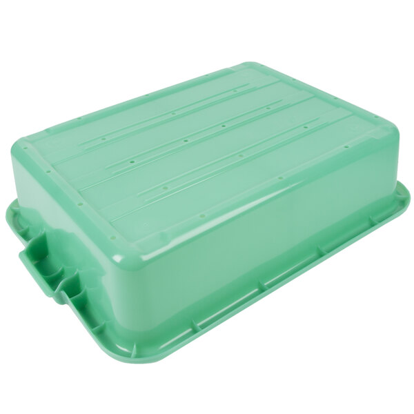 A green plastic Vollrath Traex drain box with a lid.