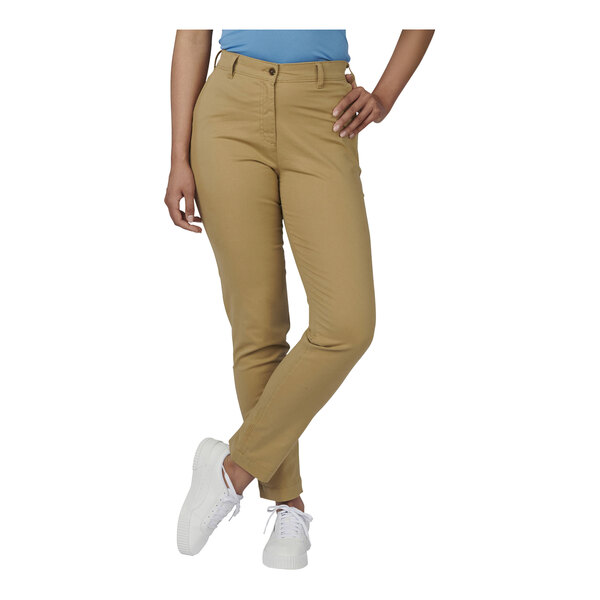 The lower half of a woman wearing tan Edwards 4-way stretch pants.