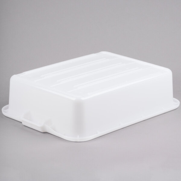 A Vollrath white plastic perforated drain box.
