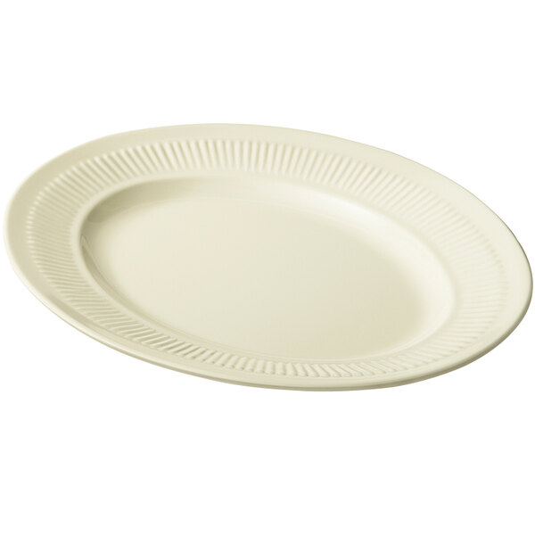 A white platter with a ribbed edge.
