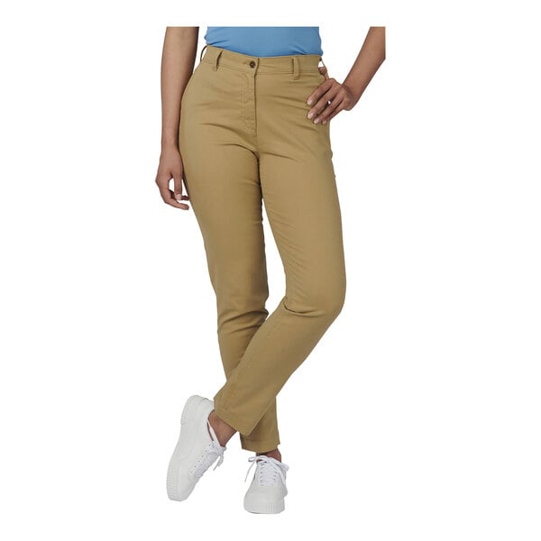 The lower half of a woman wearing tan Edwards 4-way stretch pants.