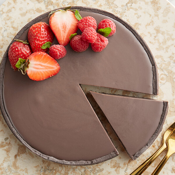 A slice of chocolate pie with a fork.