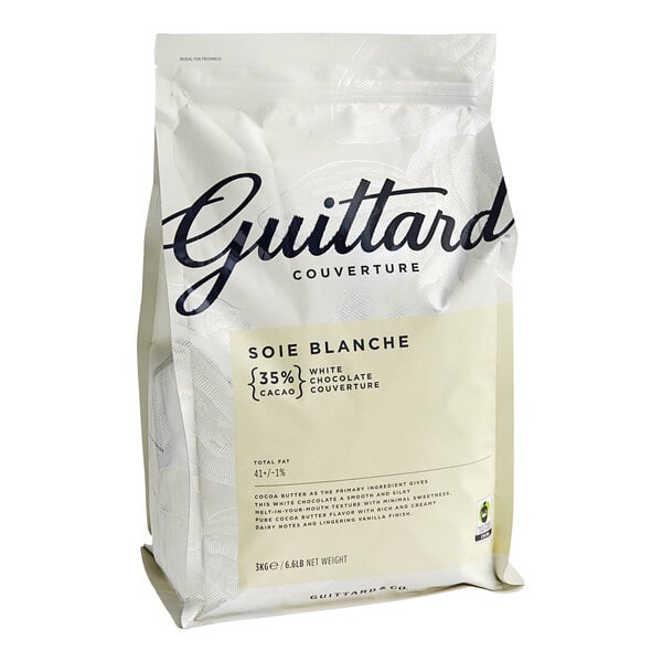 A white bag of Guittard white chocolate wafers with black text.