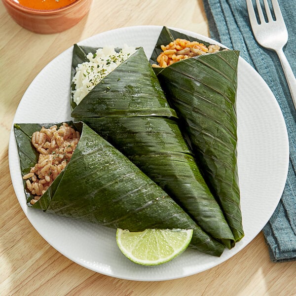 A plate of food with a banana leaf on it.