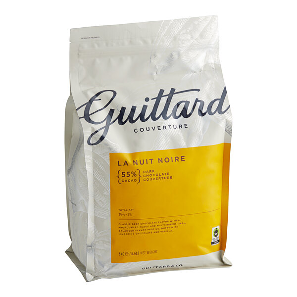 A white bag of Guittard La Nuit Noire semi-sweet chocolate wafers with a yellow label.